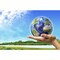 Human Hand Holding Earth Globe With A Green Landscape Background Poster Print